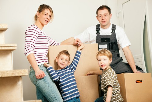 Movers loading boxes and furniture for a Highbury home move