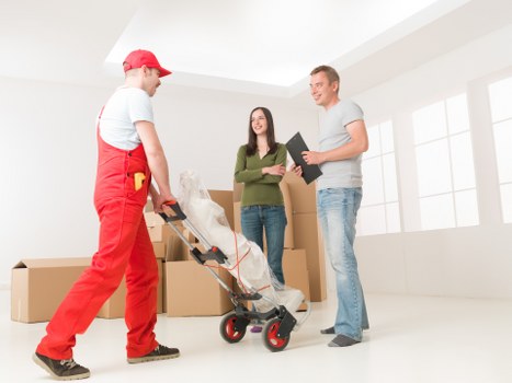 Professional movers loading household items for a local Highbury relocation