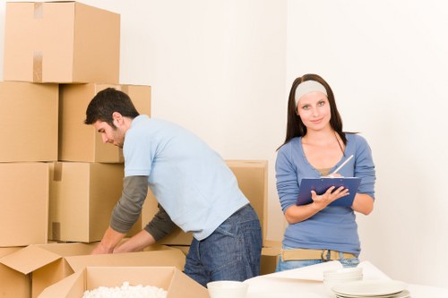 Residential flat move with boxes and removal team in Highbury