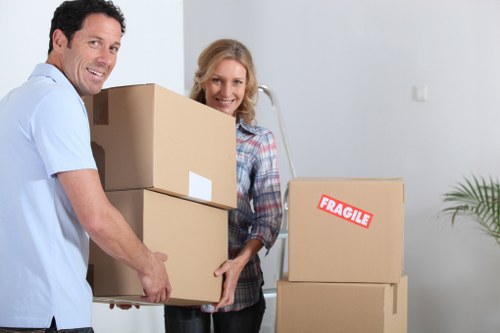 Packed moving boxes and wrapped furniture ready for house removals